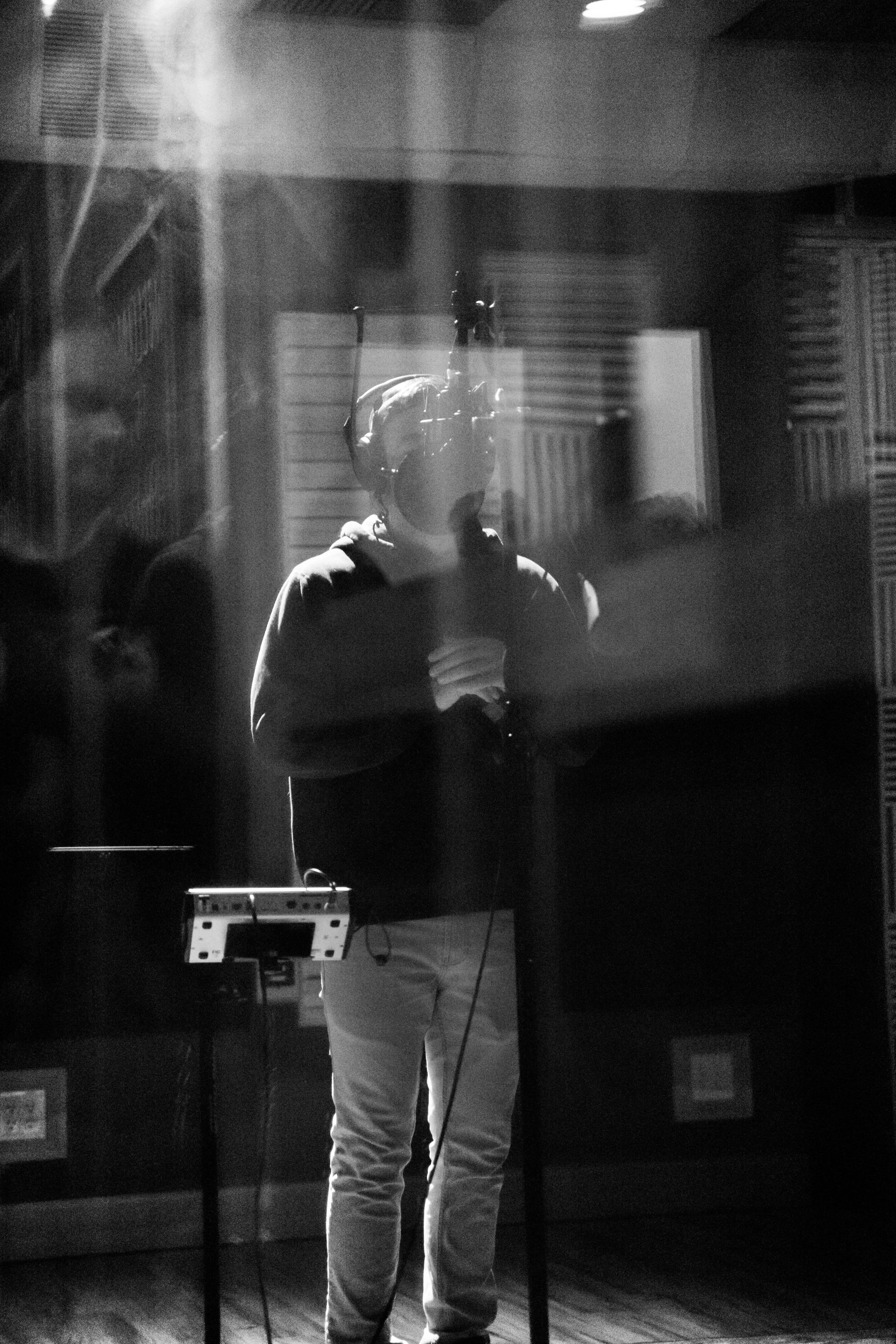 Artist recording inside a vocal booth